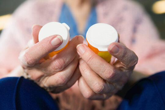 View of a senior woman holding medicines