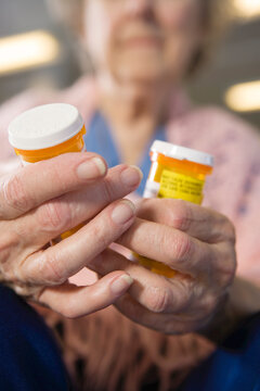 View of a senior woman holding medicines