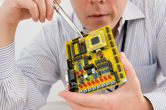 Businessman showing a circuit board