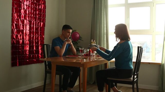 Son blows out candles on cake
