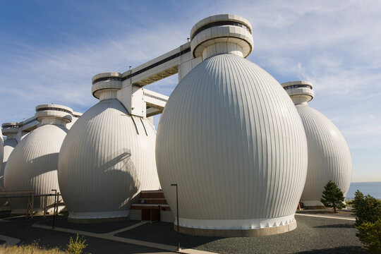 Low angle view of digester tanks in a water treatment plant
