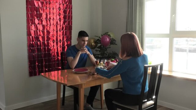 Son blows out candles on cake again