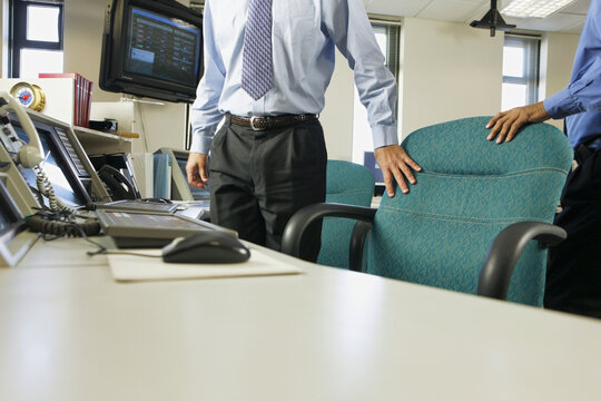 Two operating engineers in a control room