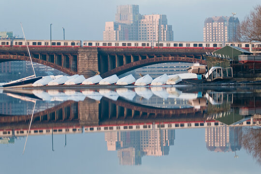 Train moving on the bridge with sail boats in the river, Longfellow Bridge, Charles River