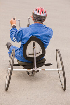Disabled man riding a racing bike