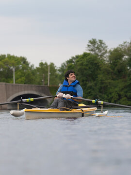 Man with cerebral palsy rowing an outrigger canoe in the race