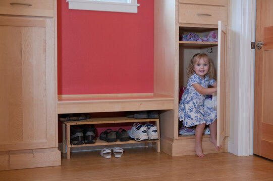 Girl in a closet of a disability accessible home