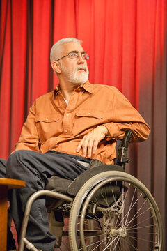 Man with muscular dystrophy and diabetes in a TV studio as a commentator
