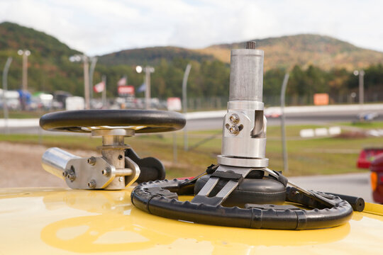 Practice wheel for hand controlled simulator on the top of a stock car for racing