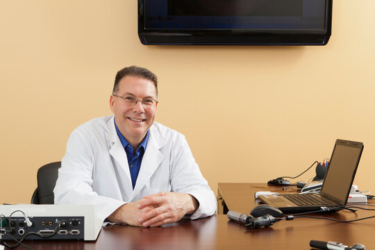 Audiologist with instruments for hearing evaluation