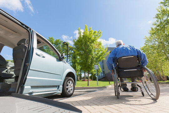 Man with muscular dystrophy and diabetes moving away from an accessible van