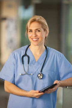 Portrait of a female nurse holding a digital tablet