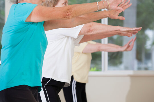 Senior people exercising in an exercising class