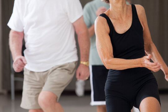 Senior people exercising in an exercising class