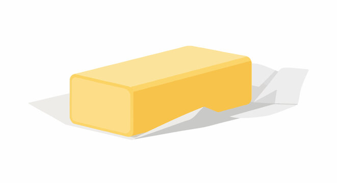 A yellow, rectangular block of butter is partially unwrapped from its white paper packaging