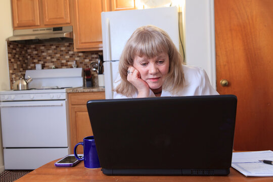 Woman with Bipolar disorder working from home on her laptop