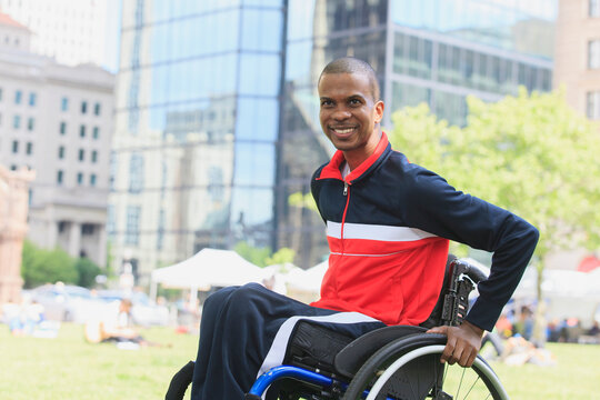 Man in wheelchair who had Spinal Meningitis shopping at a farmer's market