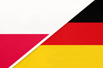 Obraz premium Poland and Germany national flags on fabric background, international partnership and cooperation between two countries