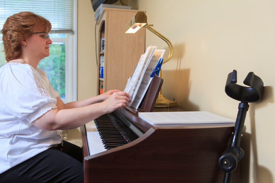 Woman with RSD playing her piano
