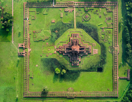 Aerial view of the ancient ruins of Sompur Mahavihara featuring the central cruciform temple and monastic cells surrounded by green lawns Naogaon District, Rajshahi Division, Bangladesh.