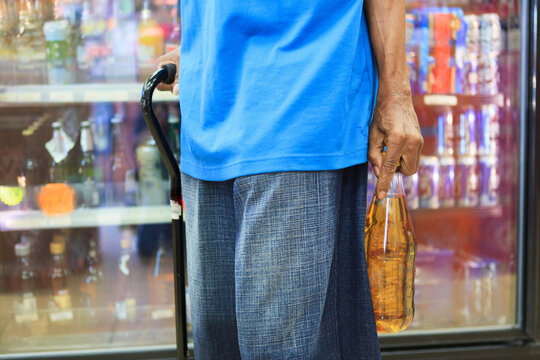 Man with Traumatic Brain Injury purchasing some liquor