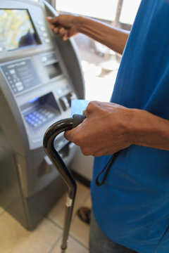Man with Traumatic Brain Injury using a bank ATM