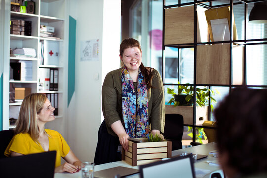 Smiling new employee welcomed in modern office
