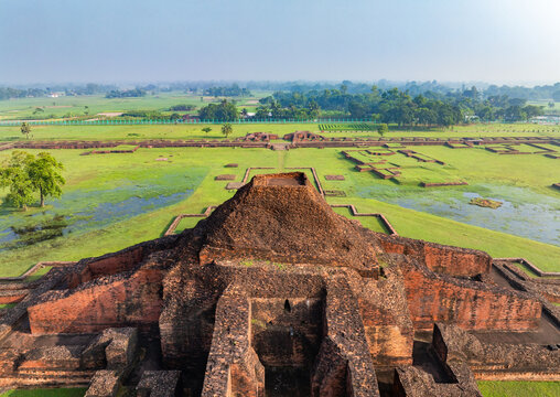 Aerial view of the ancient ruins of Sompur Mahavihara featuring the central temple structure and surrounding green fields in Naogaon District, Rajshahi Division, Bangladesh.
