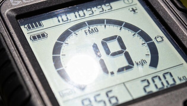 Displaying digital instrument showing 19 kph with semicircular gauge on bike handlebar cluster