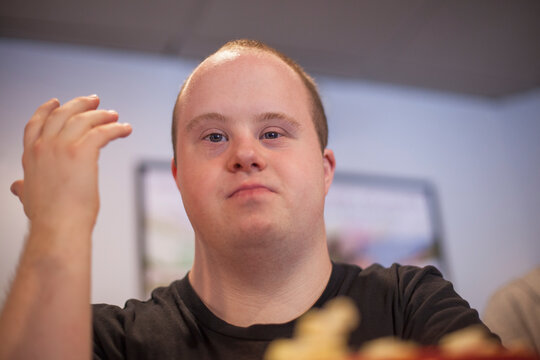 Portrait of waiter with Down Syndrome in a restaurant