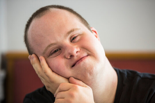Portrait of waiter with Down Syndrome in a restaurant