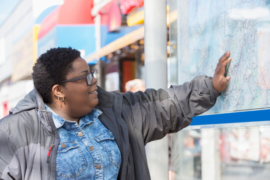 Woman with bipolar disorder studying a subway map
