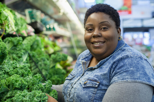 Happy woman with bipolar disorder shopping for food