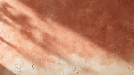 Fototapeta premium abstract terracotta and cream plaster wall with sunlight shadows