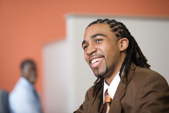 A Business man smiling in an office