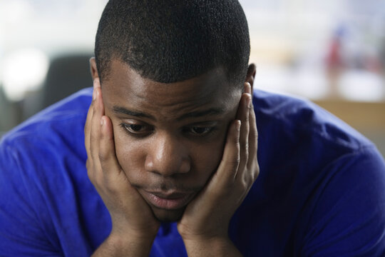 Close up of a depressed young man