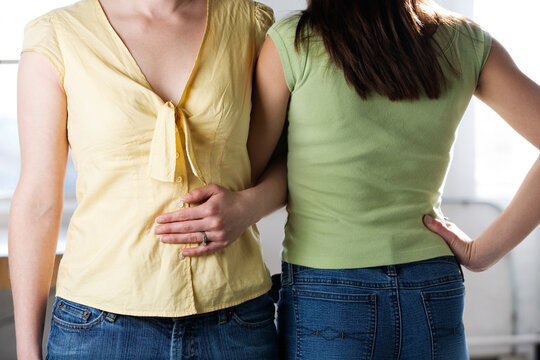 Midsection of two friends