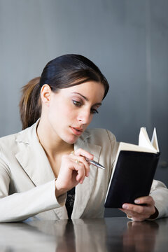 Business woman looking at her planner