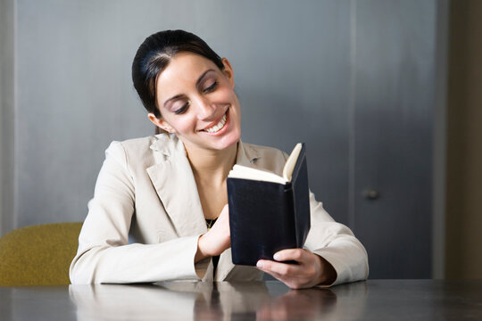 Business woman looking at her planner
