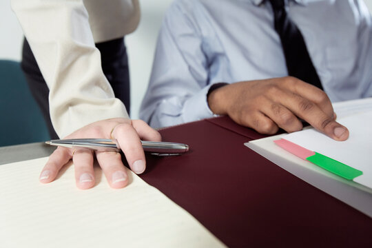 Close up of business people working in office