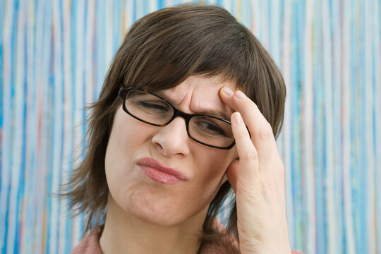 Close-up of a businesswoman living with a headache