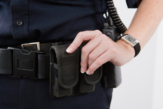 Close up of pouches on a cop's waist belt