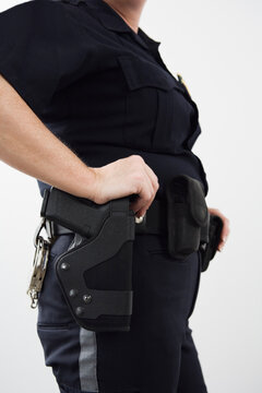 Police woman with a holstered handgun