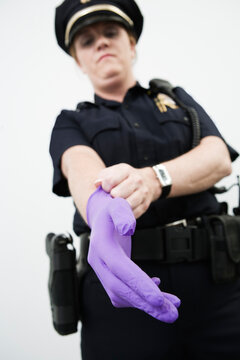 Woman police officer wearing a glove