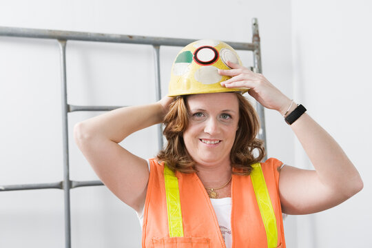 Portrait of a smiling woman wearing hard hat