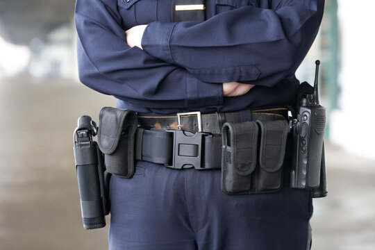 Midsection of a female police officer standing