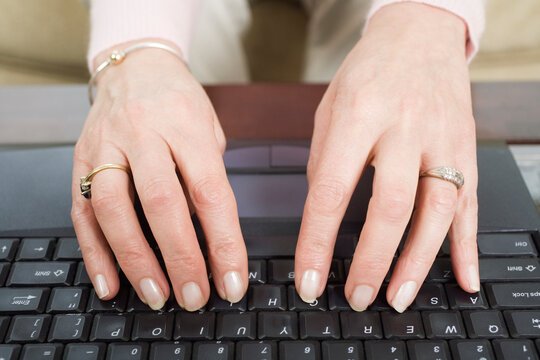 Close up of a mature woman using a laptop