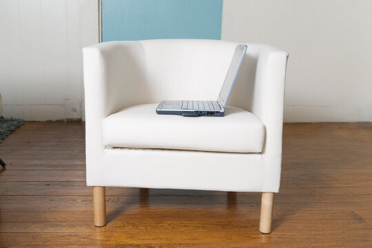 View of a laptop computer on lounge chair