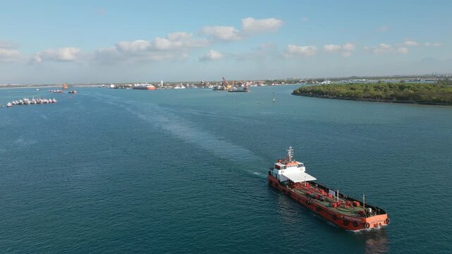Ship Leaves Bali Indonesia Through Benoa Shipping Channel Drone Track Back 4K 30FPS