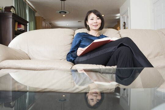 Portrait of a mid adult woman holding a document